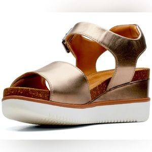 Dark gold metallic sandal with wedge heel